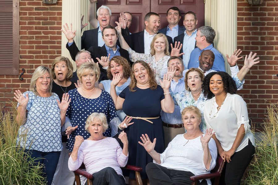 About Our Agency - Fun Group Photo of Manry Heston Team Standing in Front of Their Office Building in Tucker, Georgia